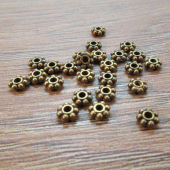 Spacer kraaltje brons