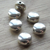 Plat rond kraaltje metaal