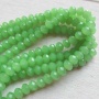 Streng facet rondellen imitatie jade lichtgroen 